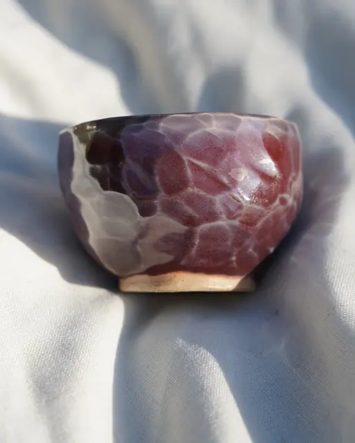 Faceted maroon bowl