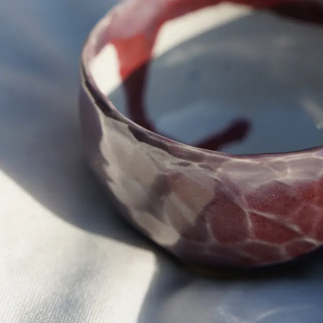 Faceted maroon bowl, interior