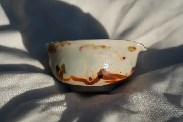 White bowl with amber drips
