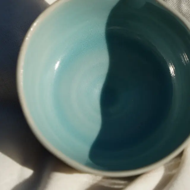 Teal spouted bowl from above