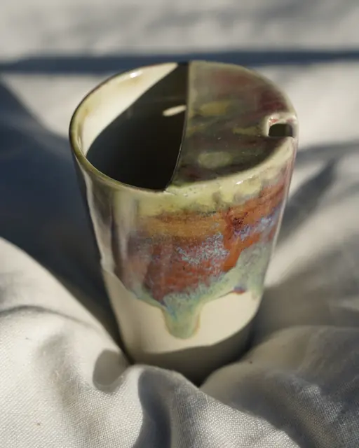 Drip-glazed cup with notched rim